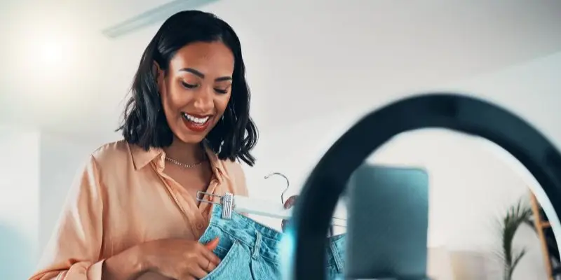Entrepreneur promoting her business online with a product showcase.